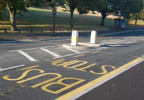 Bus stop overlaps refuge