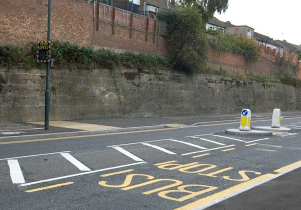 Bus stop overlaps refuge